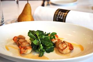 Seared Whangamata Scallops with a Pear and Vanilla Puree, Snow Pea Tendrils and Chorizo Oil.